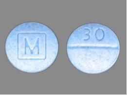 Front and back of counterfeit Percocet pills containing fentanyl