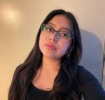 Student wearing glasses and black shirt