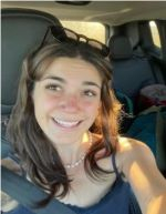 Student wearing a blue top in a car